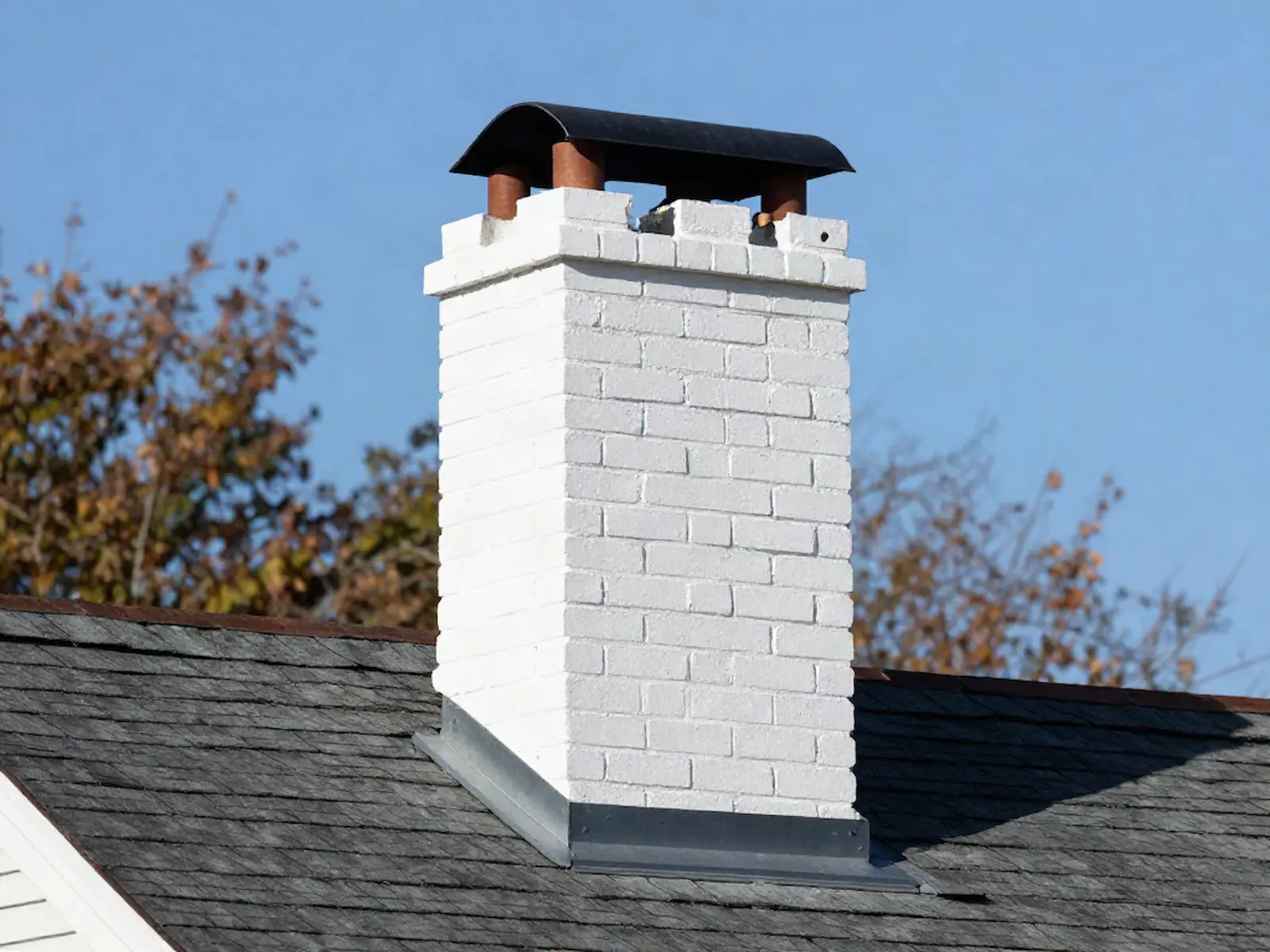 Brick chimney on a home served by R & J Chimney Sweeps in Chicago, IL